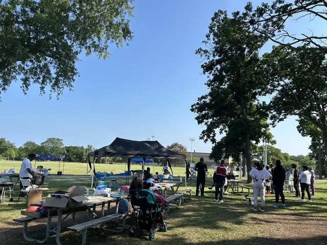 Families gathered under the trees at Smith Park