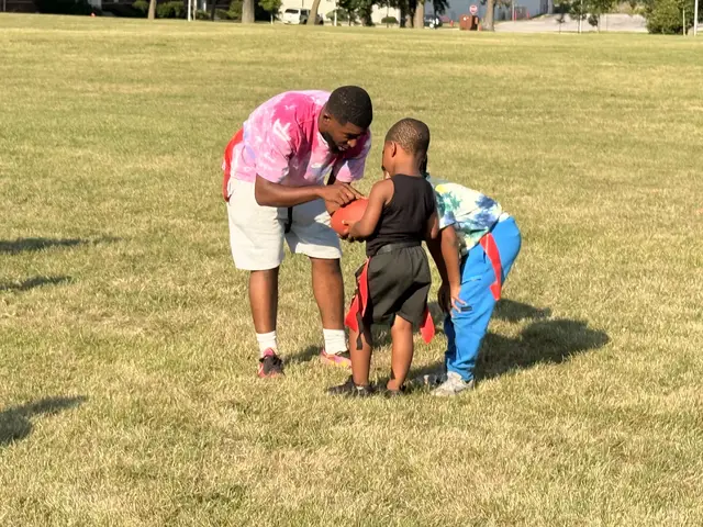 A coach offering encouragement between plays