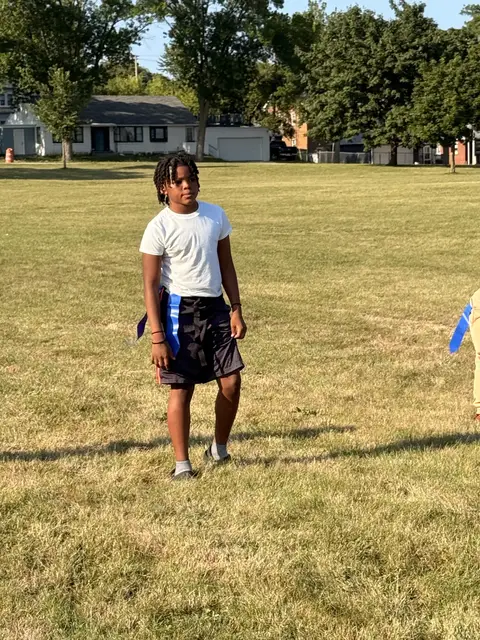 A young player waits for the next snap