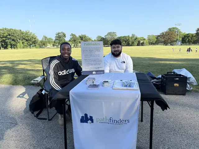 Pathfinders volunteers at their community resource table